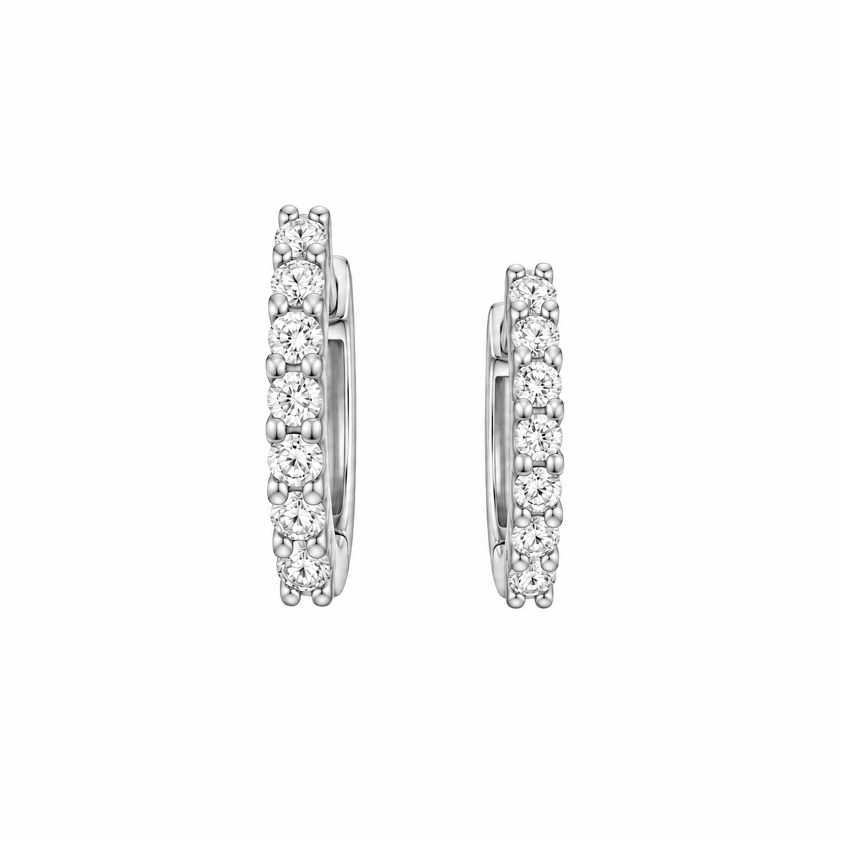 A pair of silver hoop earrings set with round-cut clear gemstones, shown against a plain white background.