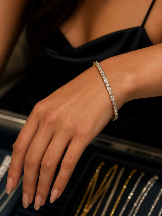 Close-up of a hand wearing a diamond bracelet with a blurred background