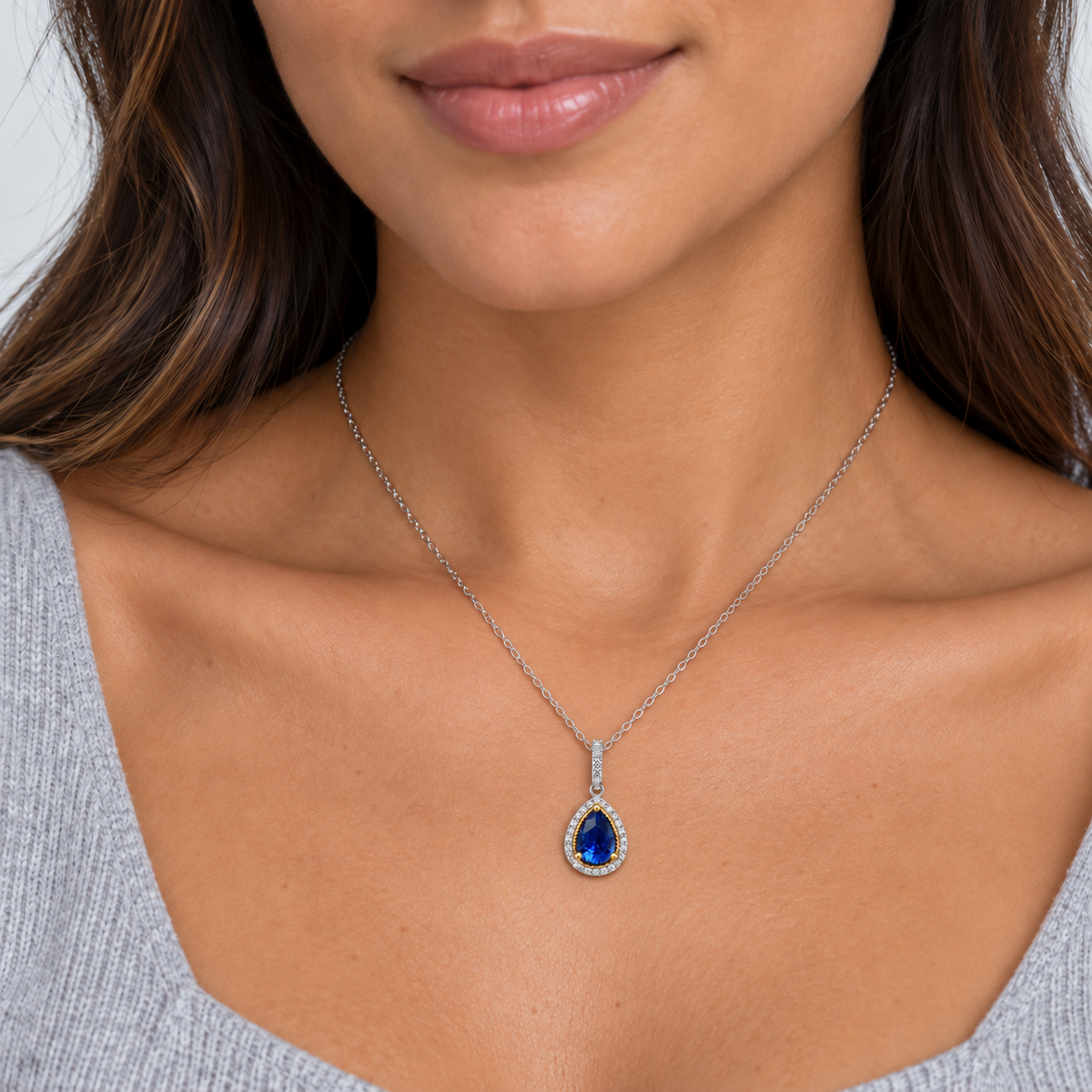 Pear Shaped Sapphire with Diamond Halo Pendant